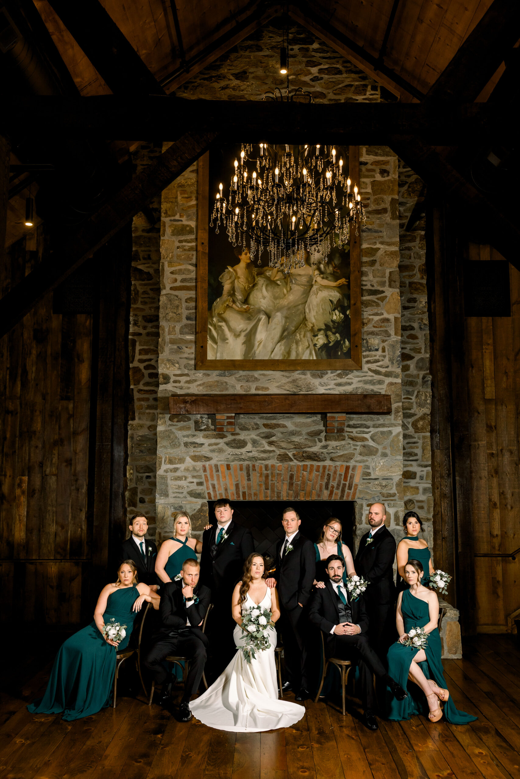 Wedding party portrait in front of the fireplace at Bentley Farms, shot with flash on a rainy wedding day