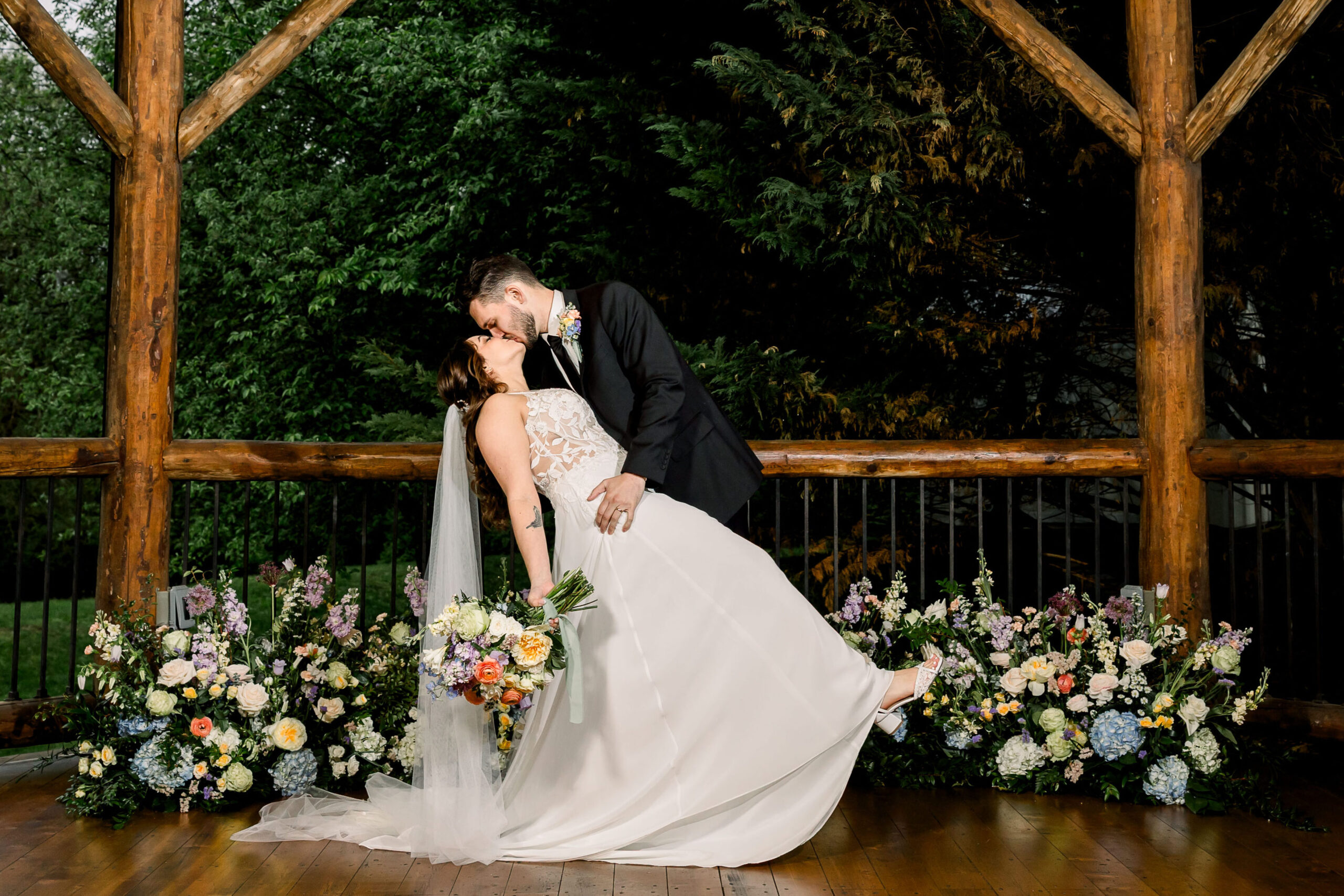 Indoor flash portrait of the bride and groom on their rainy wedding day at Riverdale Manor